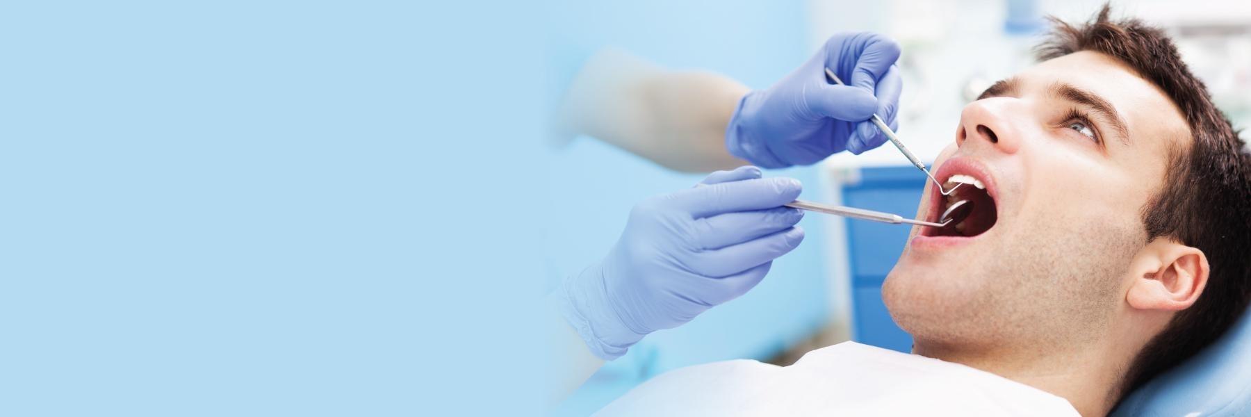 Man getting periodontal treatment in Roanoke dental office